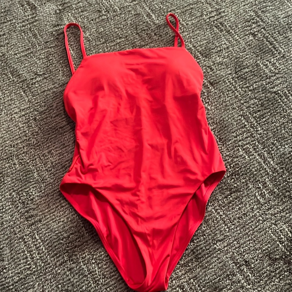Victoria’s Secret one piece with adjustable straps and removable pads. Red.